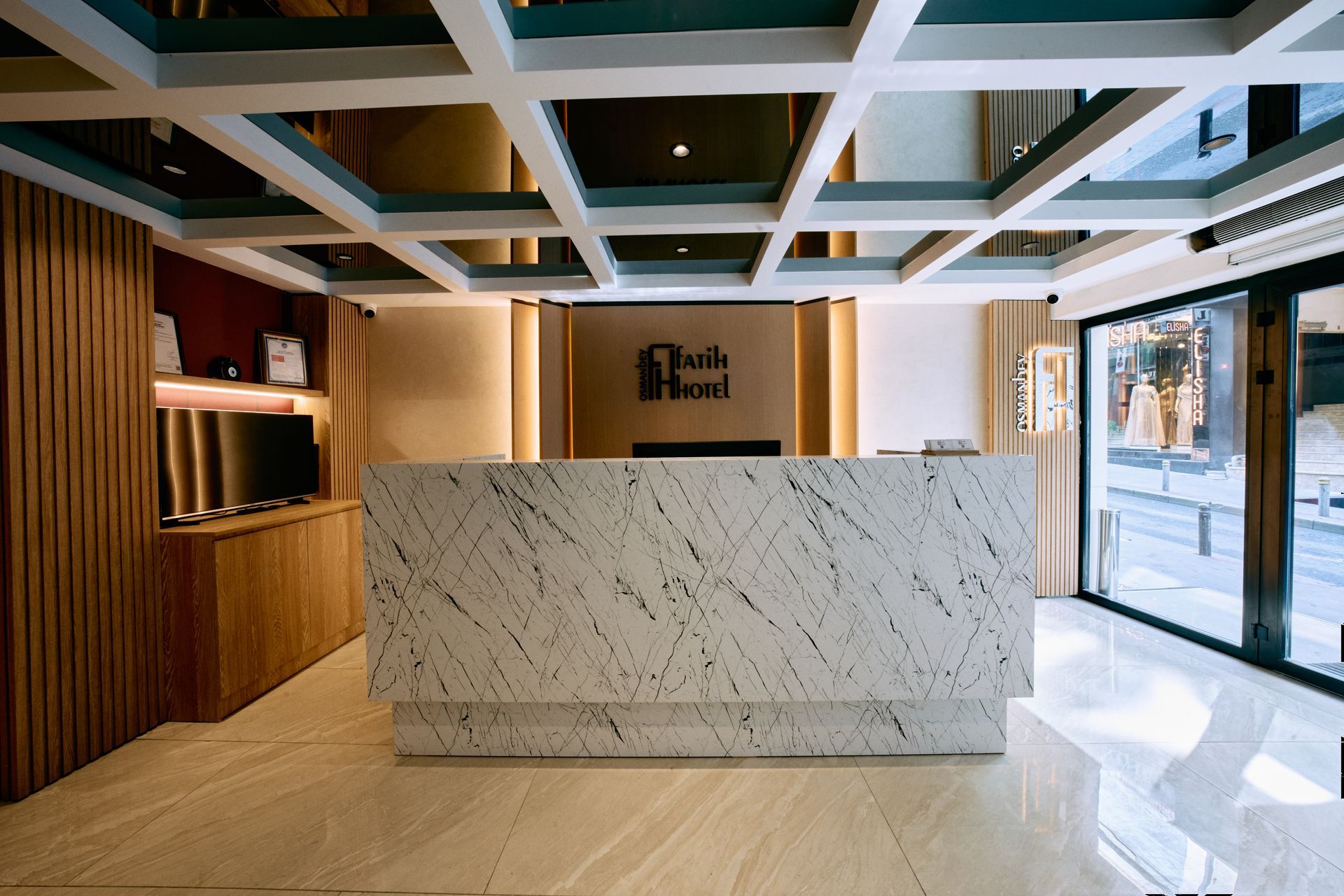 There is a large marble counter in the middle of the room.