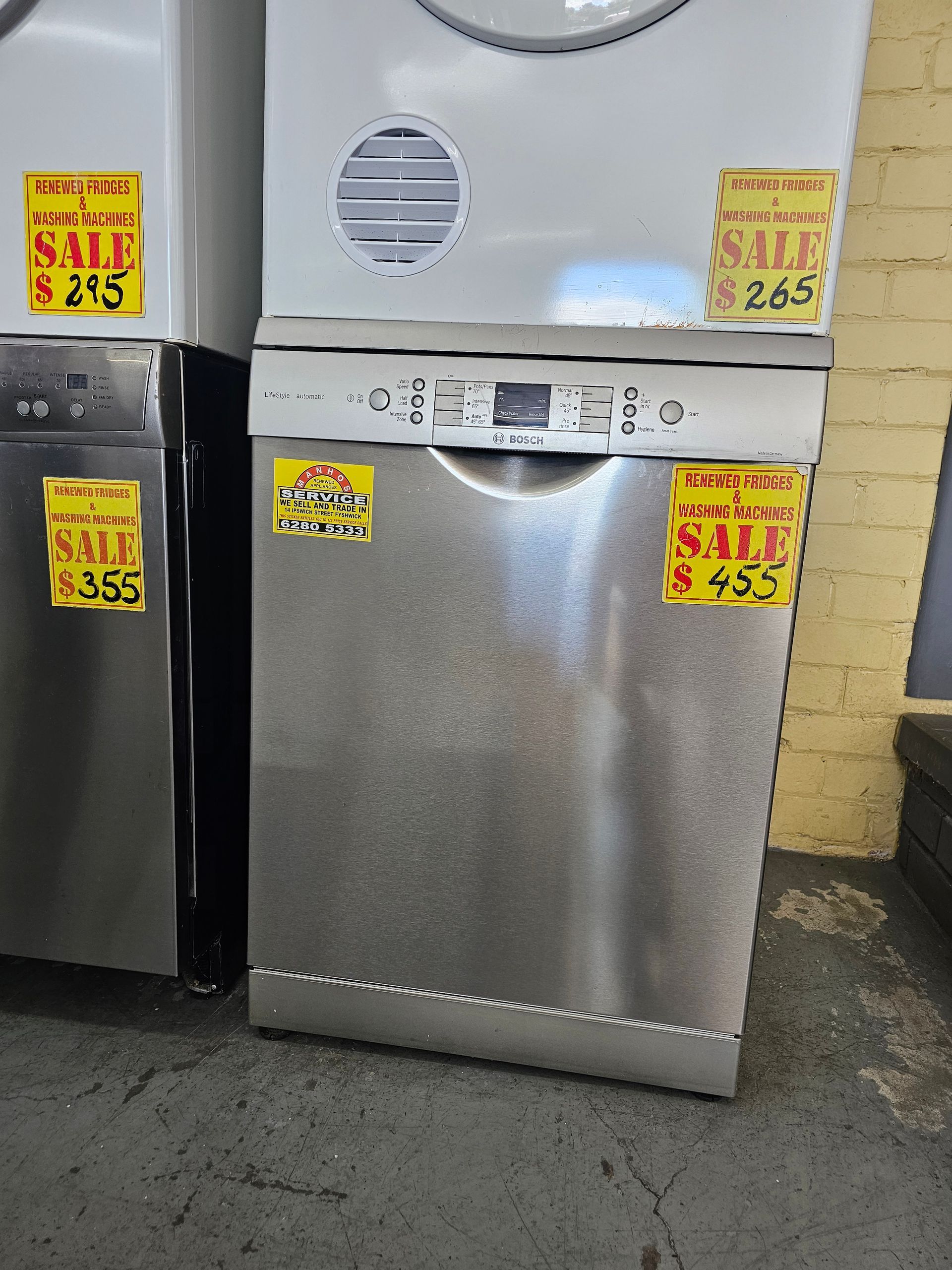 A stainless steel dishwasher is for sale in a store.