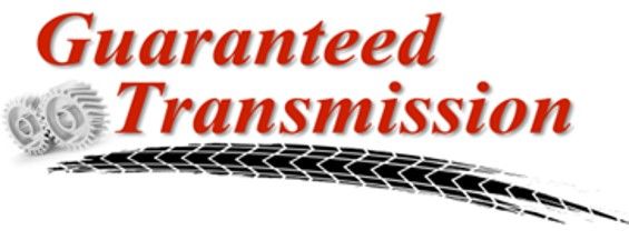 Guaranteed Transmission logo with red text, gray gears, and black tire tracks