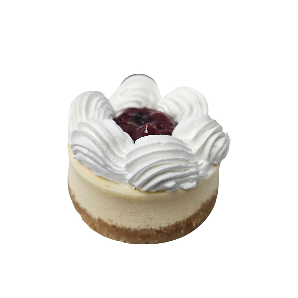 Mini tarta de queso con remolinos de glaseado blanco y cobertura de cerezas  de Azúcar y Cacao