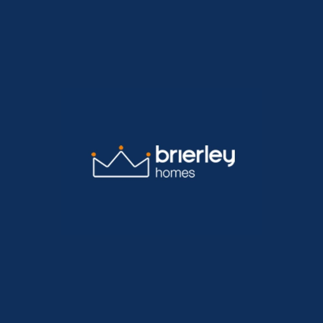 White outlined crown logo with orange details above text