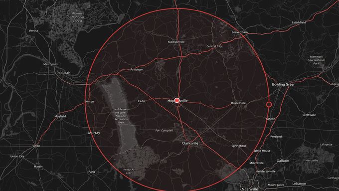 Dark map with a large red radar circle centered on a marked point.