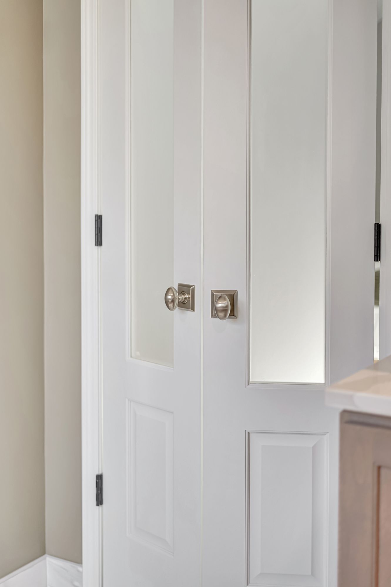 White double doors with square door hardware.