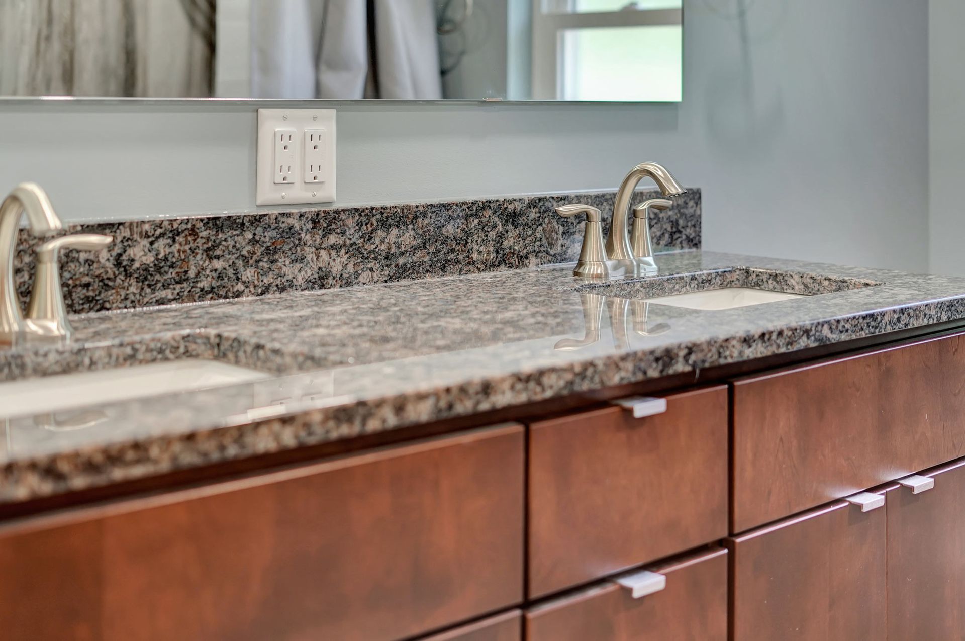 Bathroom With Two Sinks And A Mirror | Lincoln, NE | SkyLimit Remodeling