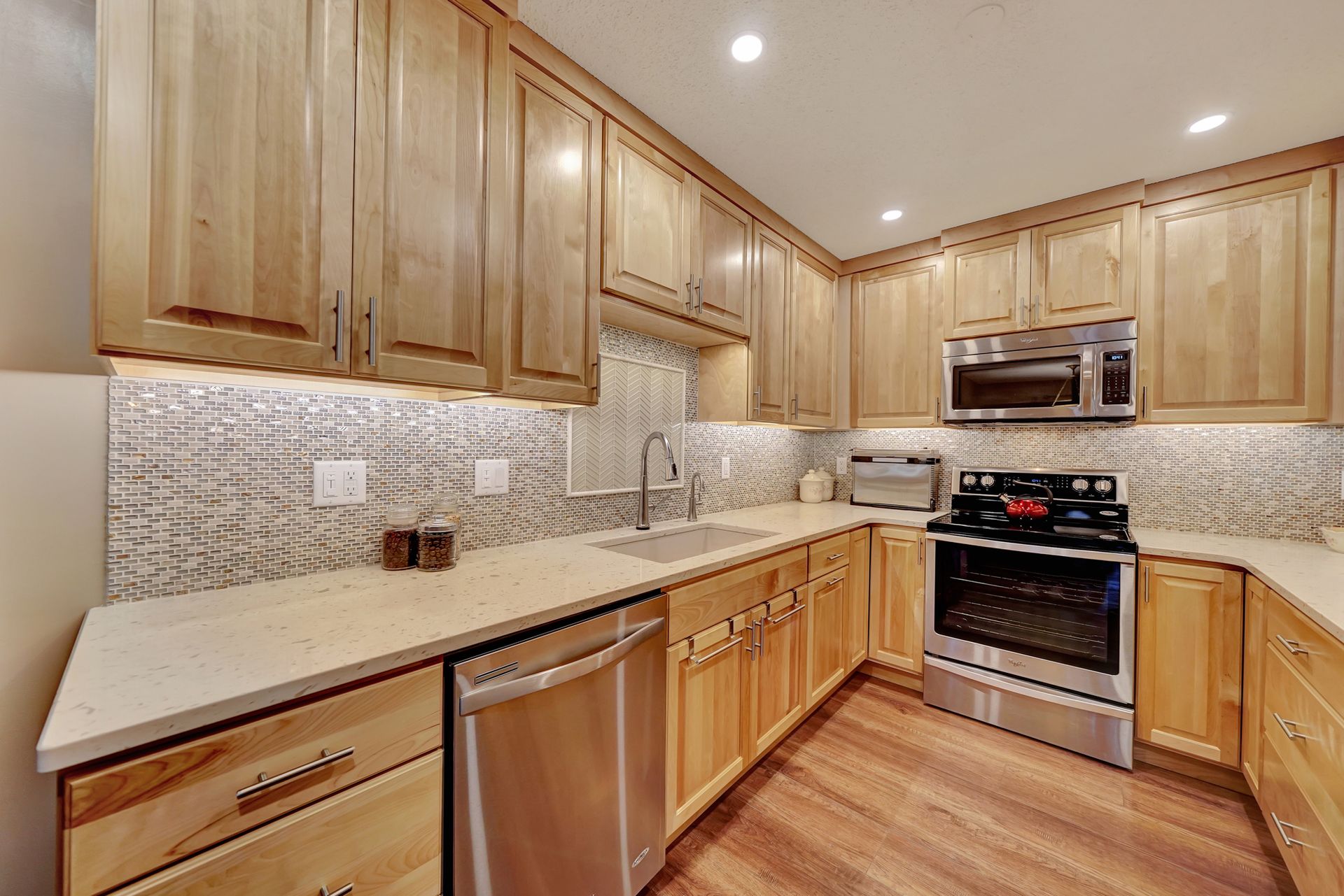 A Kitchen with Wooden Cabinets and Stainless Steel Appliances | Lincoln, NE | SkyLimit Remodeling