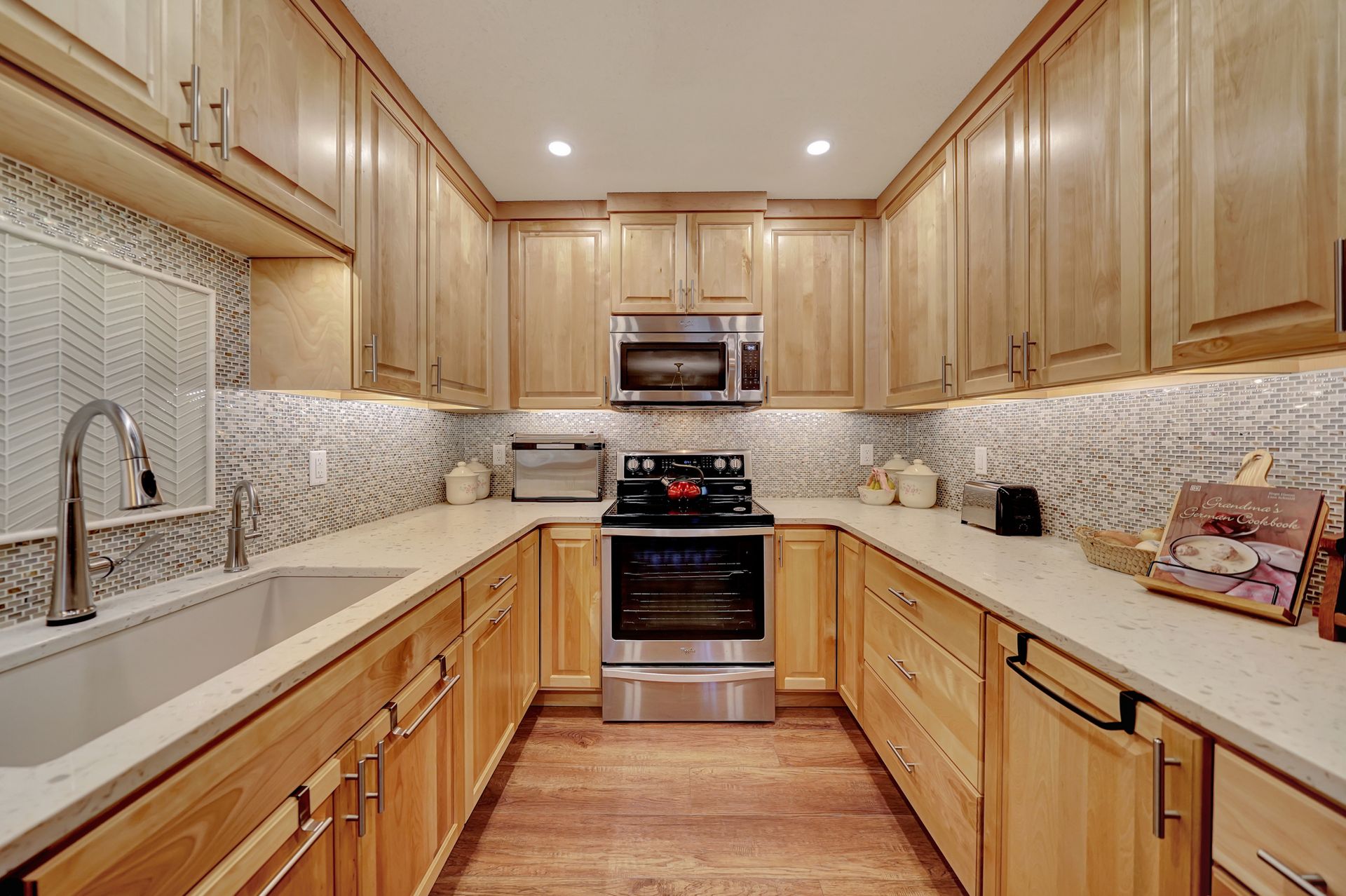 A Kitchen With Wooden Cabinets and Stainless Steel Appliances | Lincoln, NE | SkyLimit Remodeling