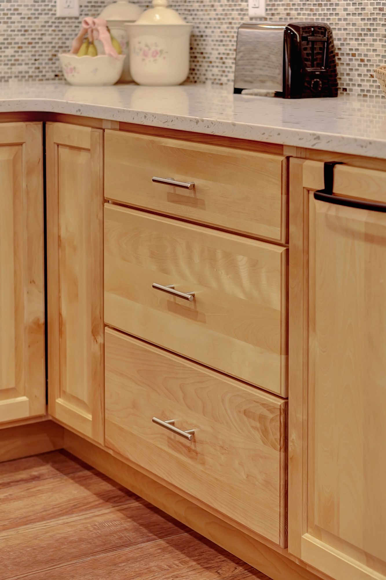 A Kitchen with Wooden Cabinets and a Toaster Oven | Lincoln, NE | SkyLimit Remodeling