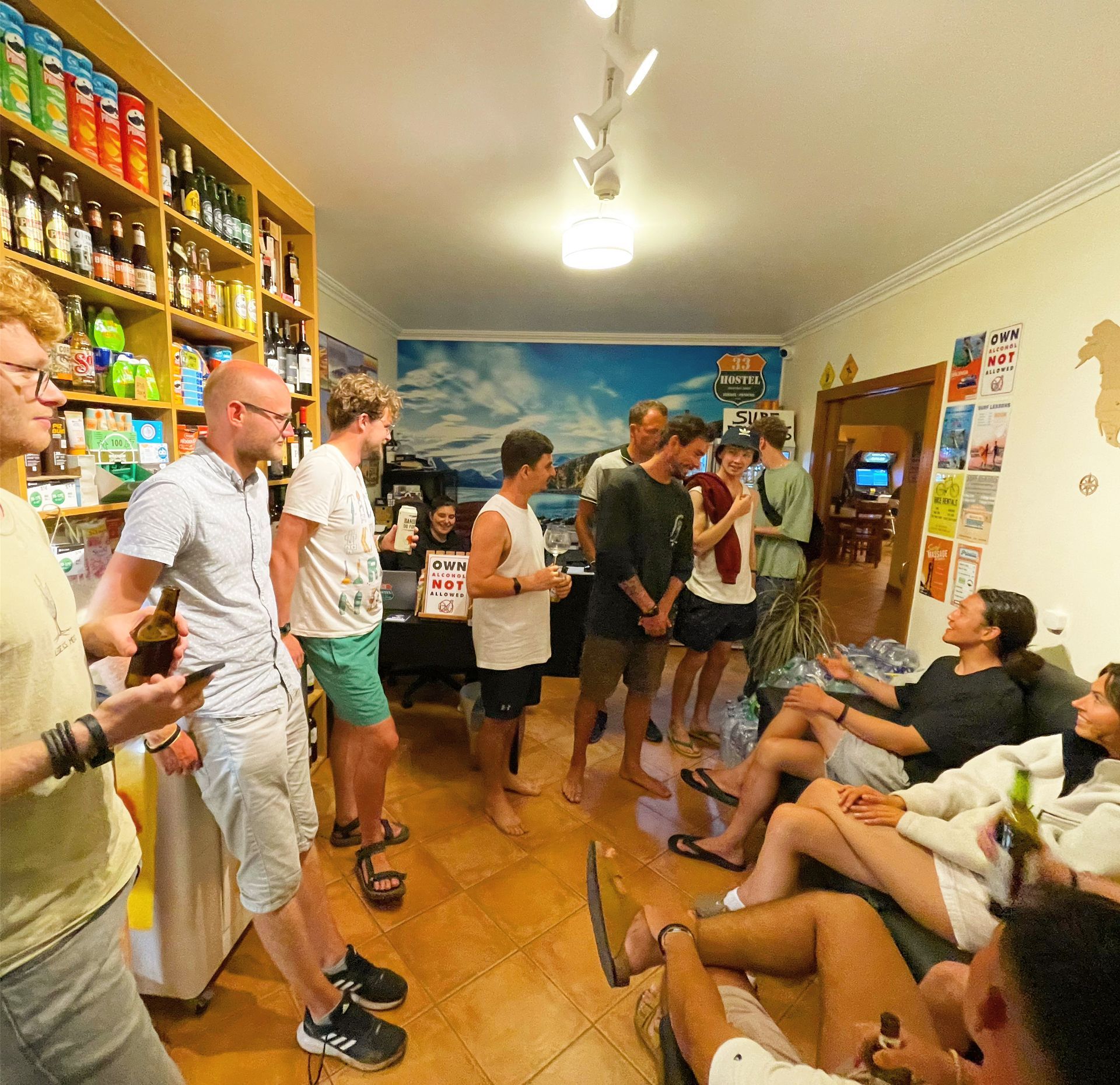 A group of people are gathered in a living room
