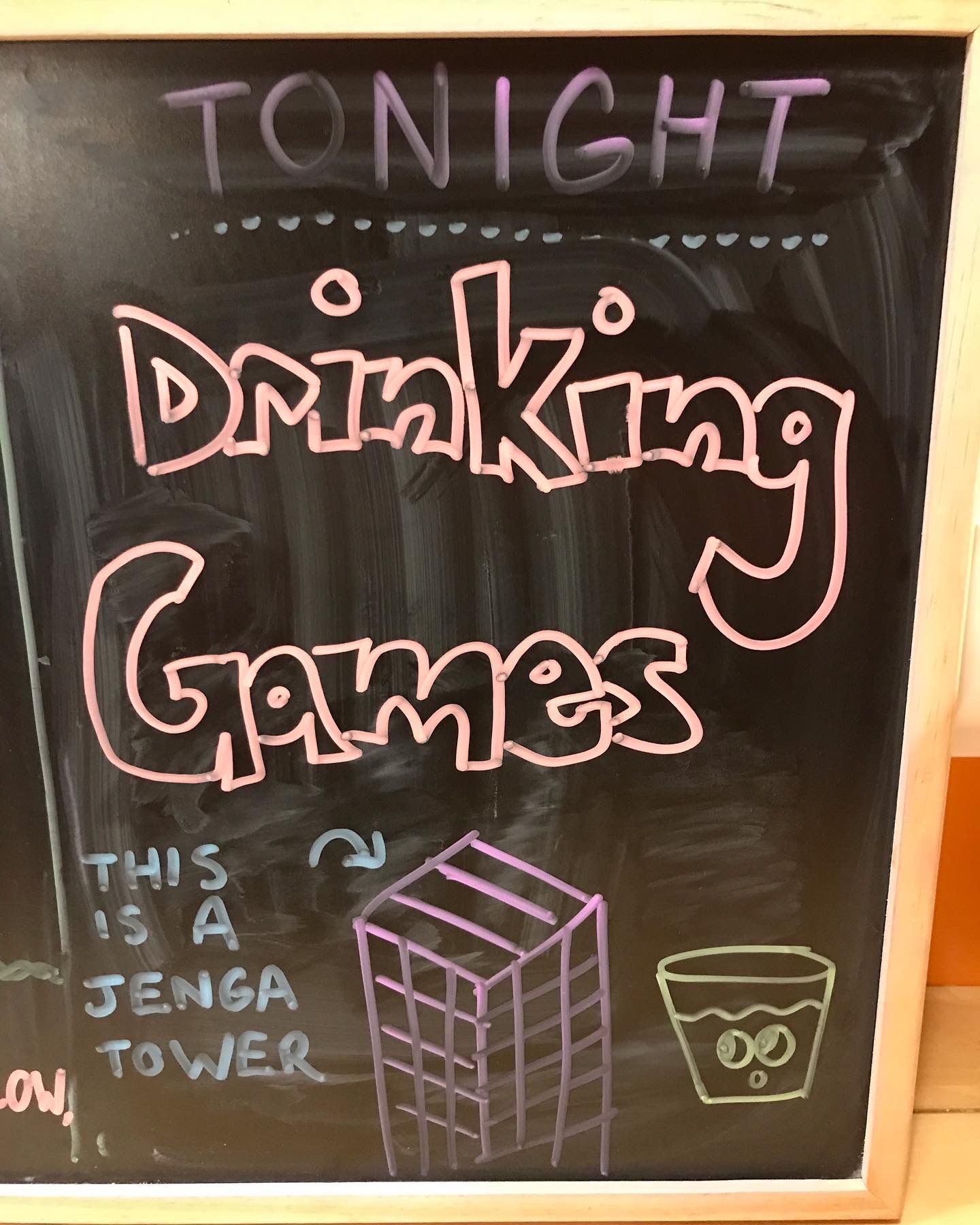 A chalkboard that says tonight drinking games