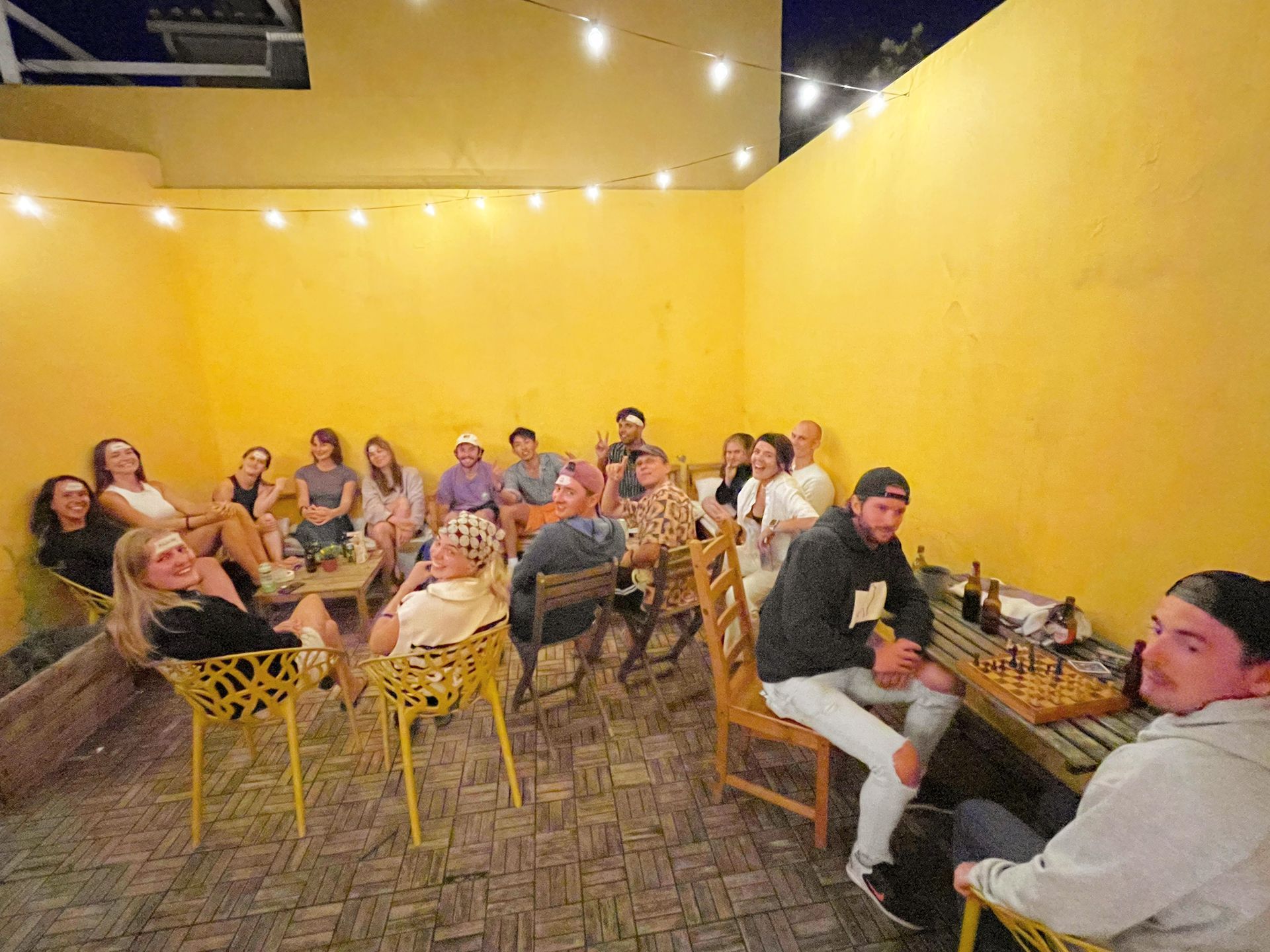 A group of people are sitting around a table in a room.