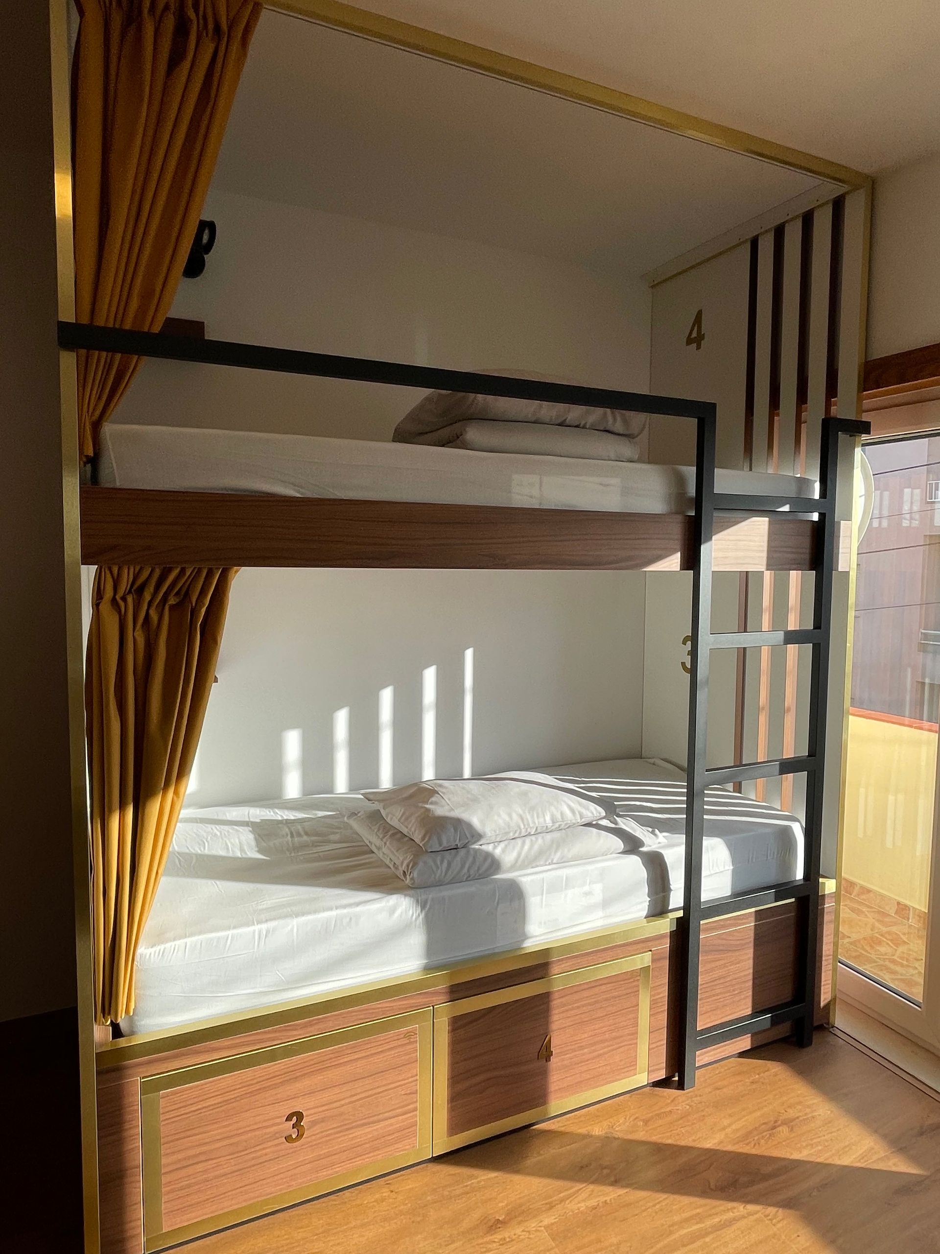 A bunk bed with two beds underneath it in a room.