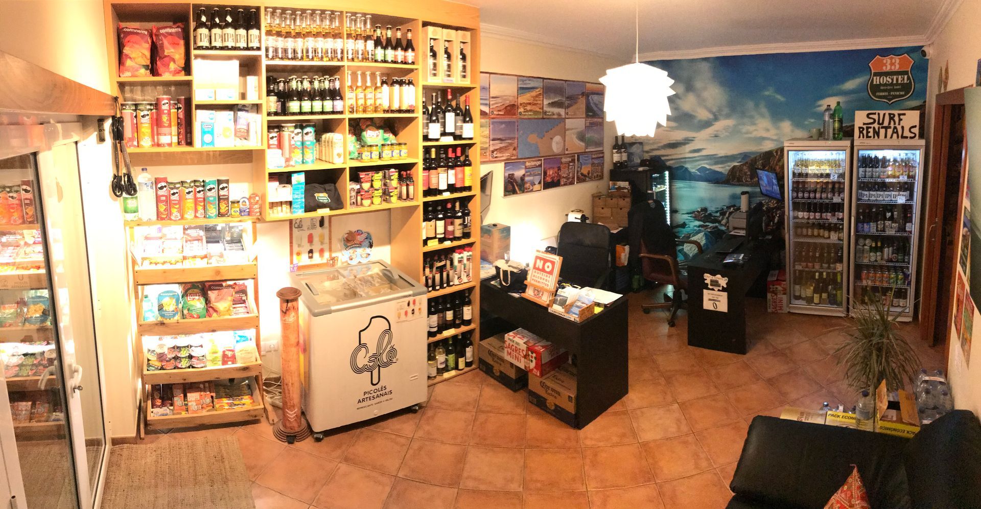 A large room filled with lots of shelves and fridges.