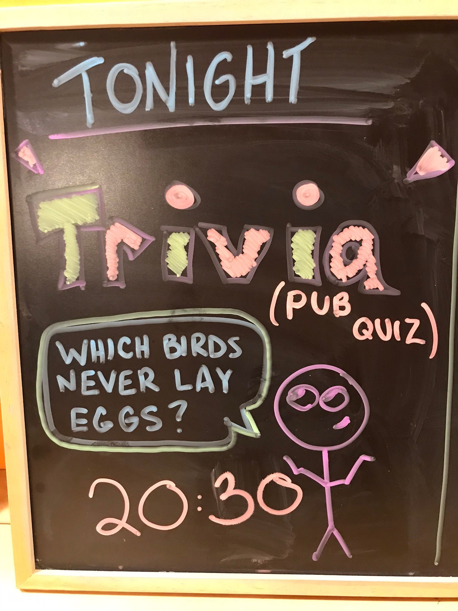A chalkboard that says tonight trivia pub quiz
