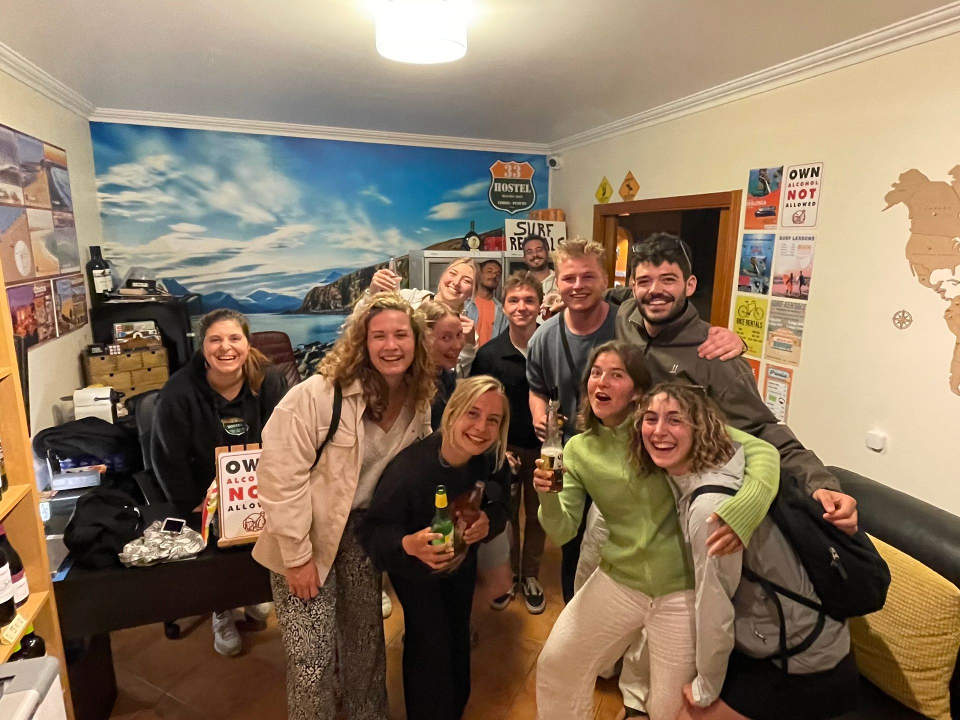 A group of people are posing for a picture in a living room.