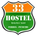 A green and orange sign that says 33 hostel