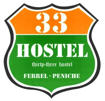 A green and orange sign that says 33 hostel