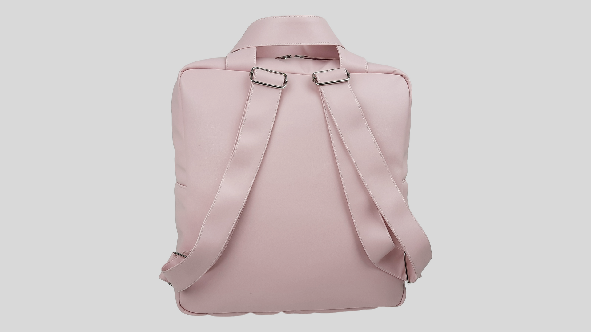 MOCHILA PELE SINTÉTICA LISA COR ROSA COM BOLSO EXTERIOR, FECHO DE CORRER, ALÇAS TRASEIRAS AJUSTÁVEIS E LAÇO