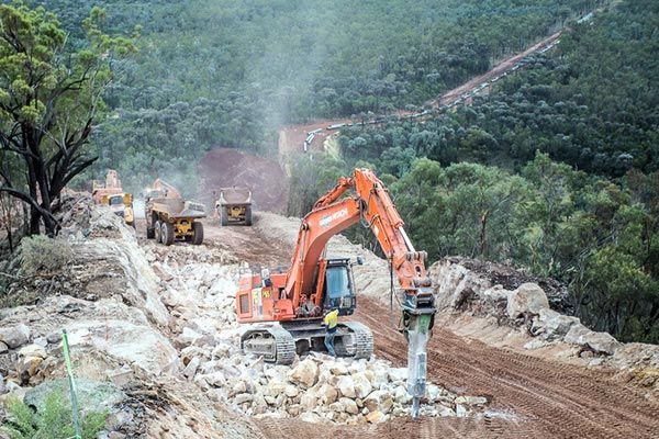 Excavator moving earth