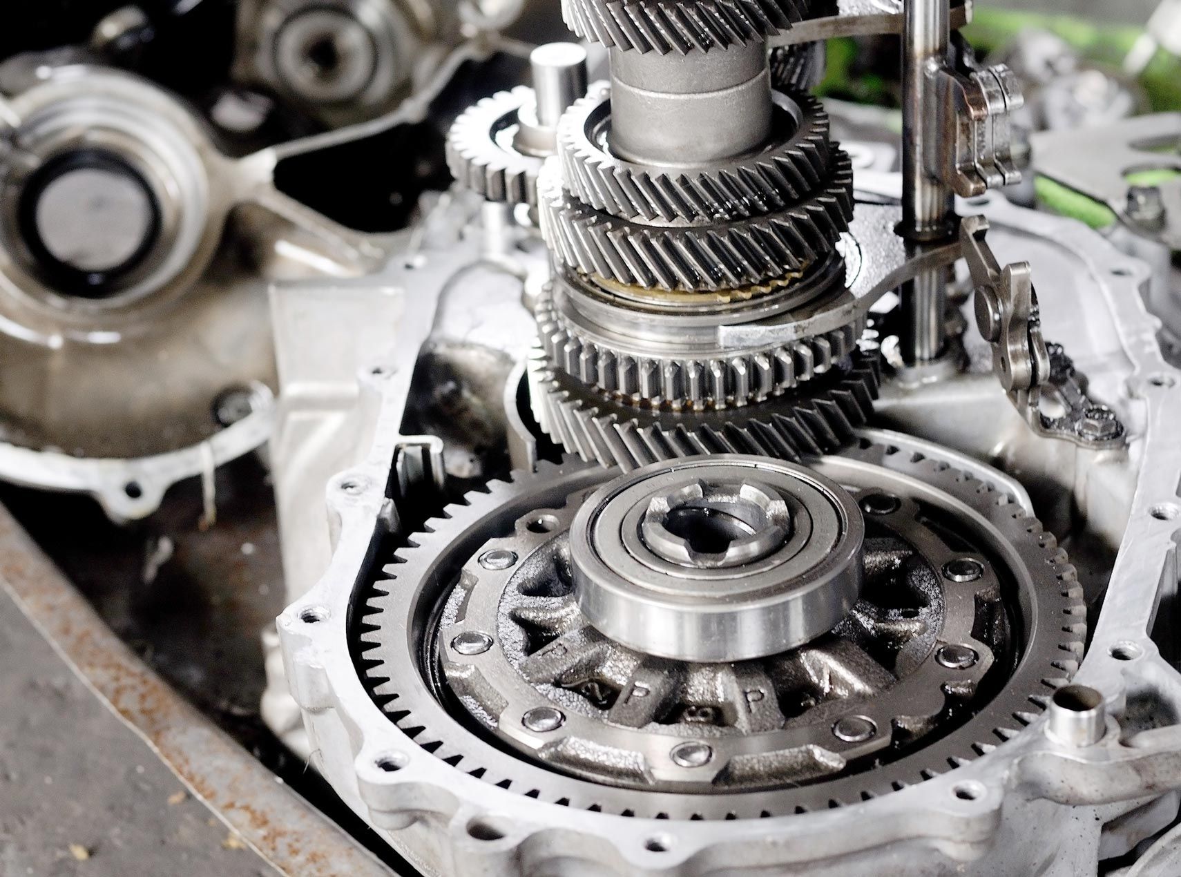 A close up of a car engine with gears and bearings A close up of a car engine with gears and bearings
