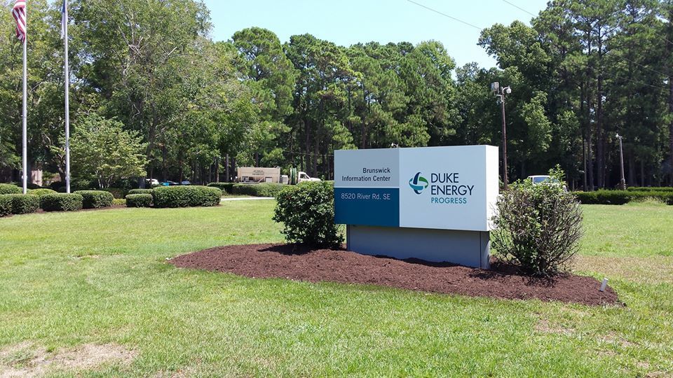 Sign for Duke Energy Board at 800 Park Blvd. in front of grassy area with trees.