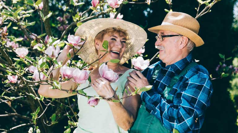 Couple picking flowers — Buford, GA — Center for Marriage Excellence