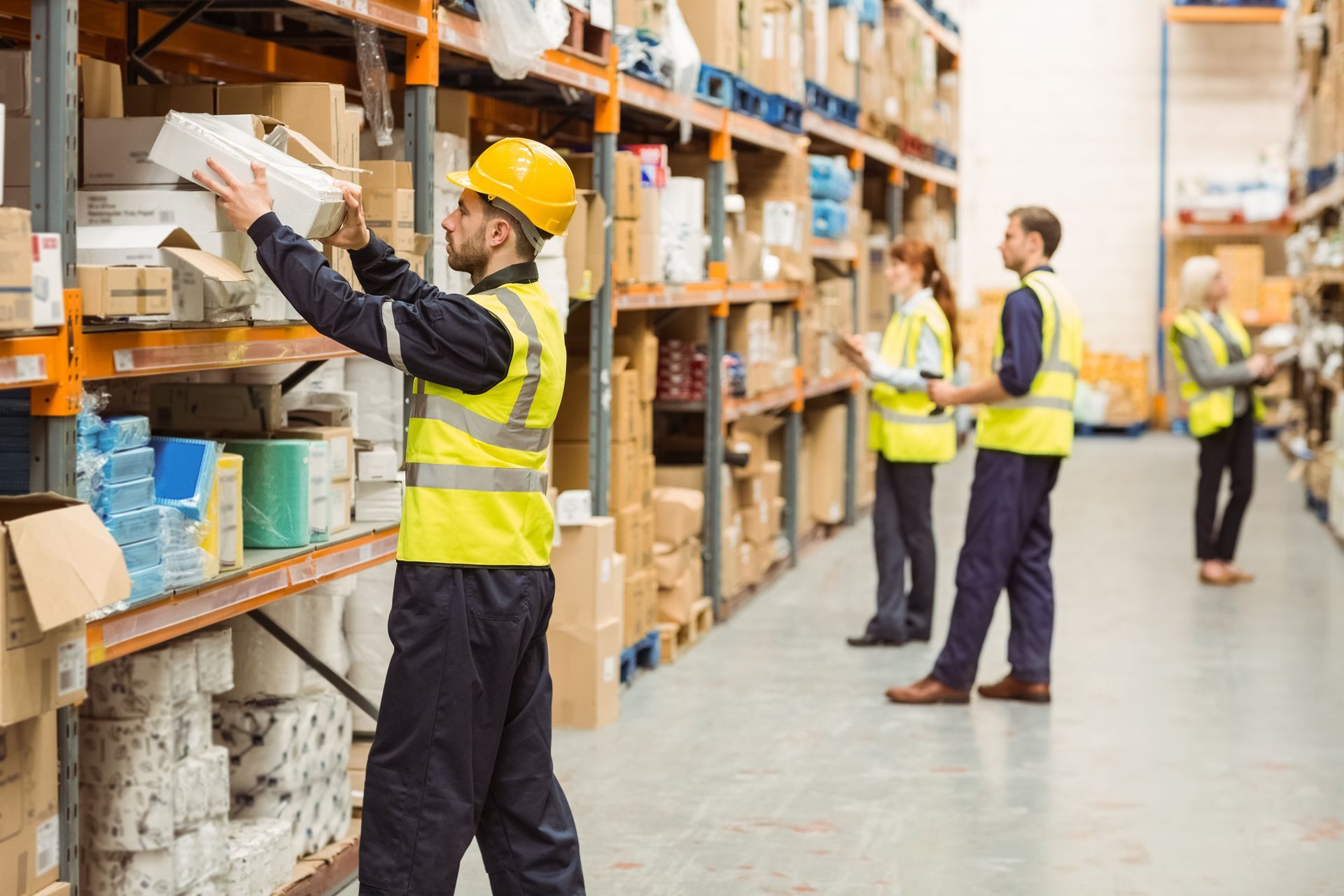 worker inside the warehouse organizing packages