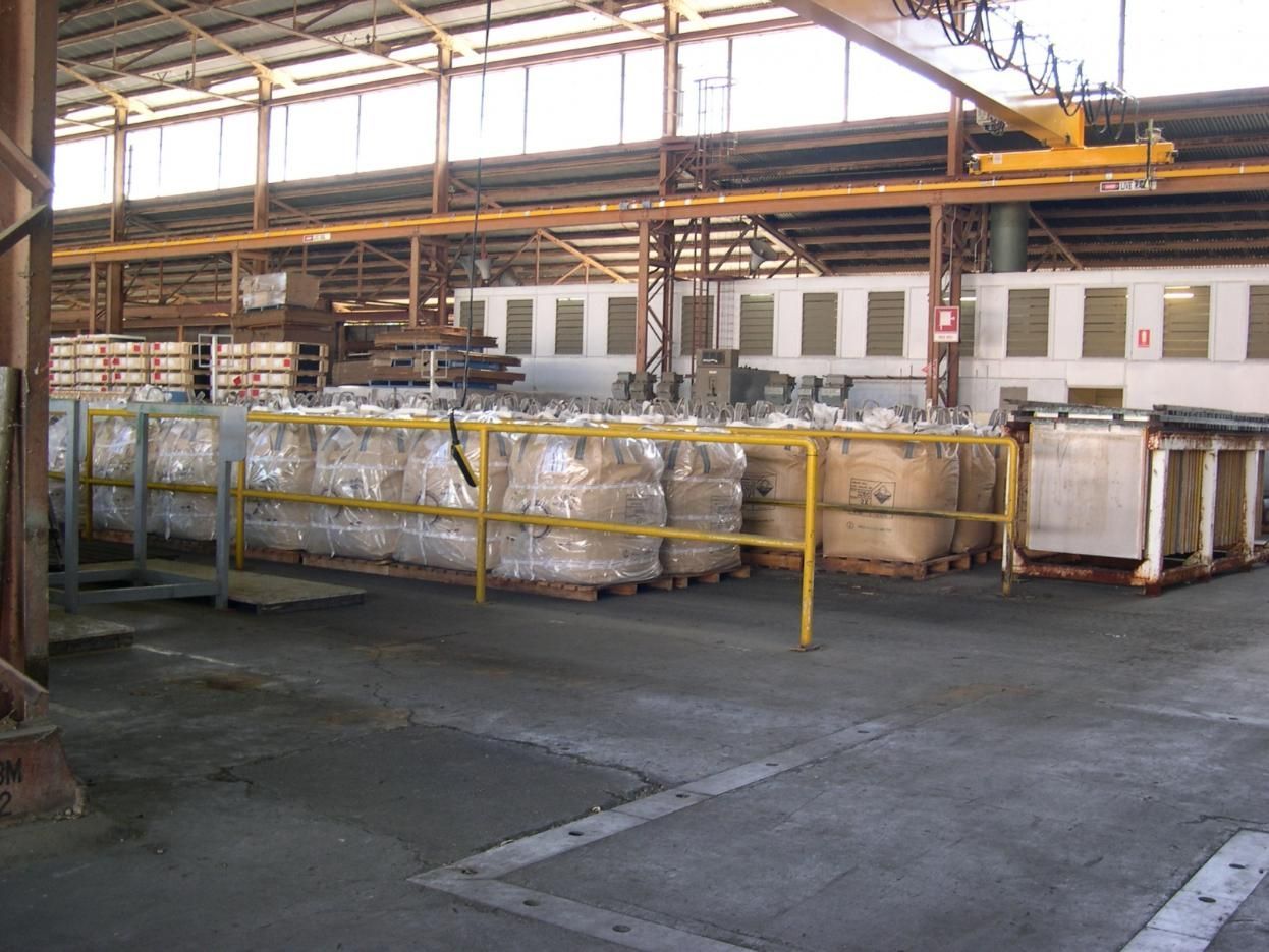 A Large Warehouse Filled With Lots Of Pallets And Boxes — Canary North Pty Ltd In Annandale, QLD