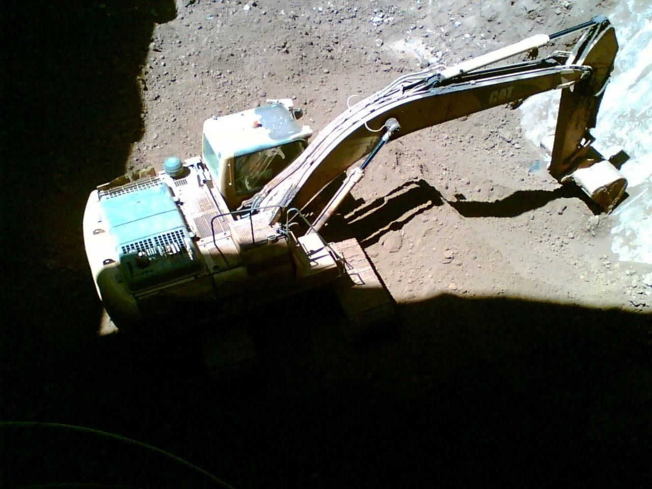 A Model Of An Excavator Is Sitting On The Ground — Canary North Pty Ltd In Annandale, QLD