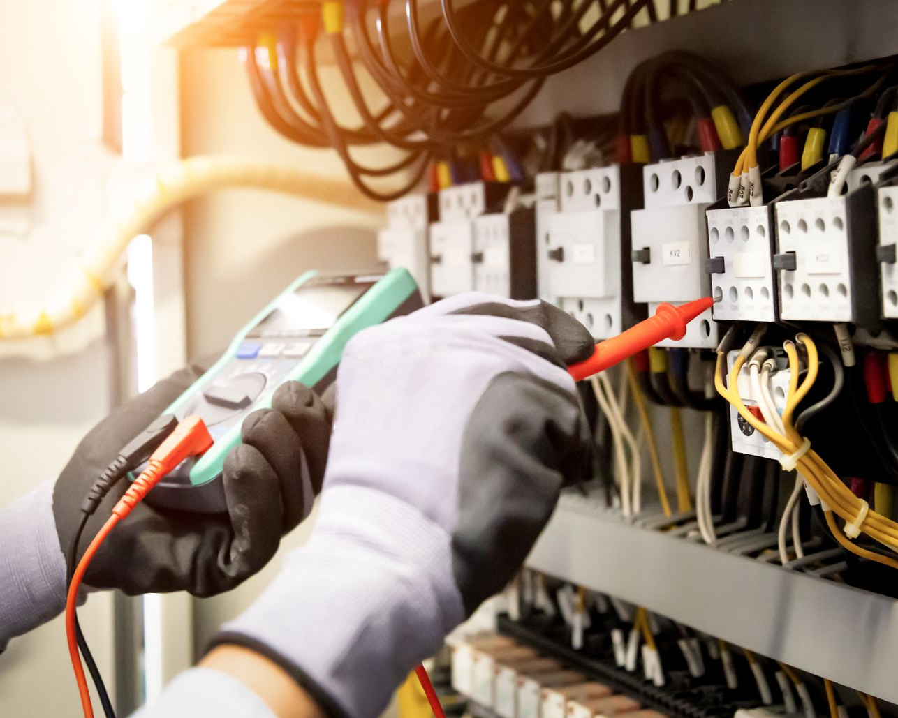 Electrical Installation Services — Electrician Installing New Outlet in Sumner, WA