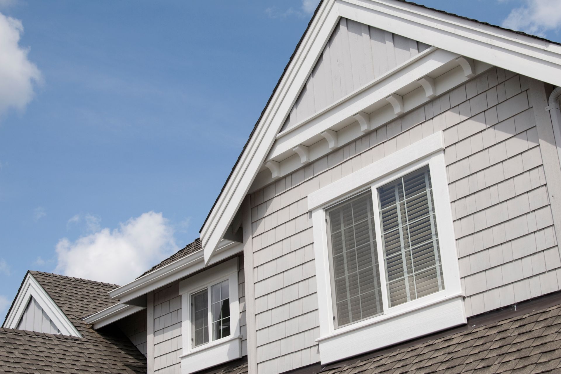 A house with a roof and a lot of windows