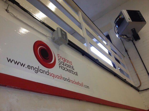 a sign that says www.englandsquashandrocketball.com on it
