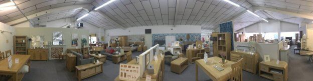a large room filled with lots of furniture and tables .
