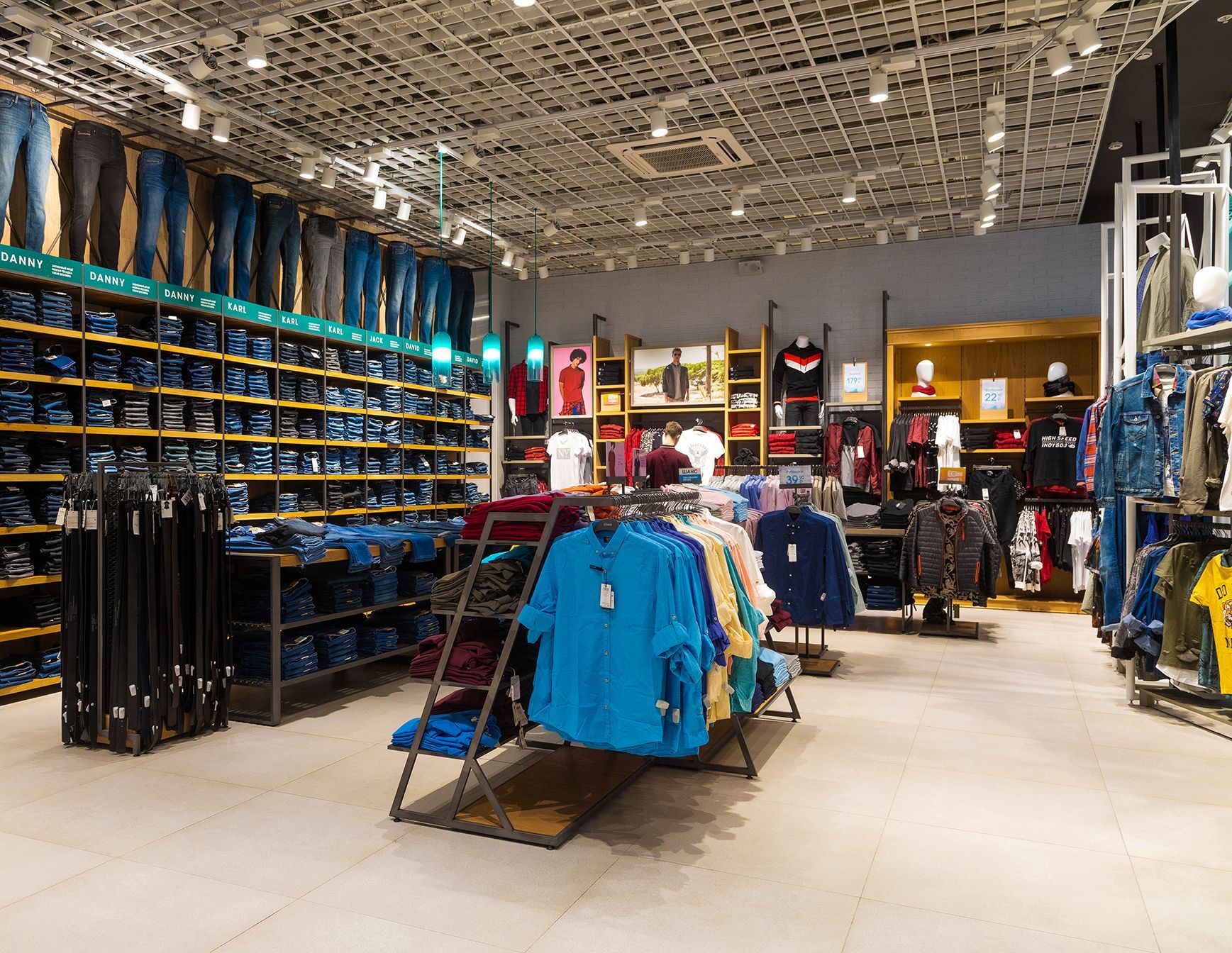 A clothing store with a lot of clothes on display.