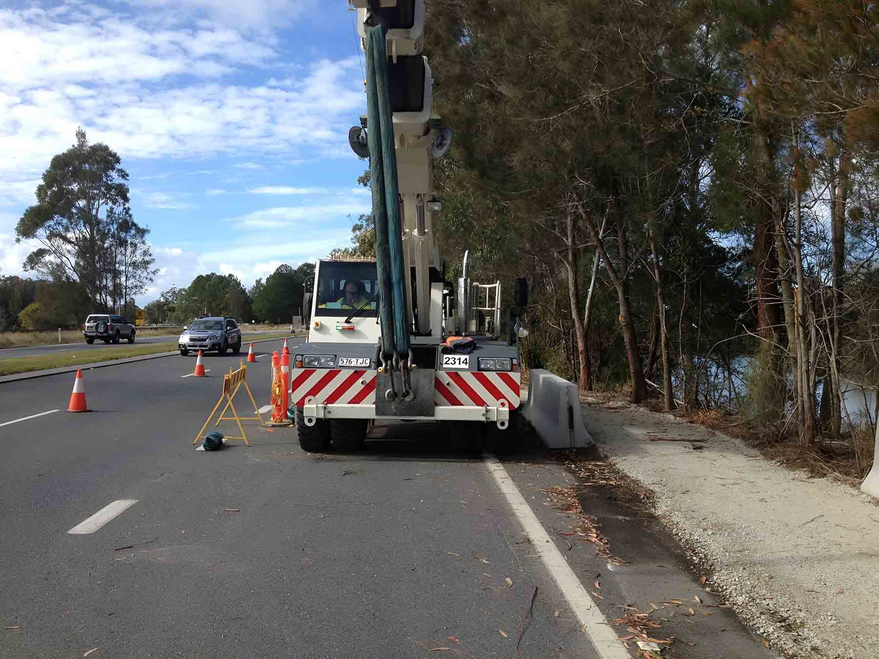 A Crane Is Parked On The Side Of The Road — North Coast Cranes In Coffs Harbour, NSW