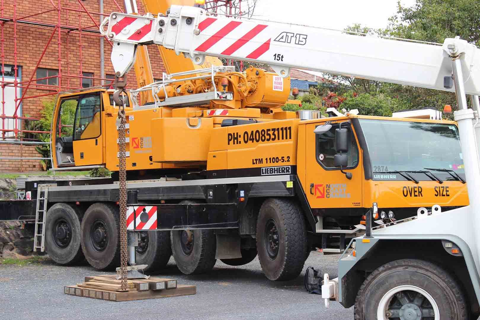 A Yellow And White Truck With A Crane On Top Of It — North Coast Cranes In Macksville, NSW