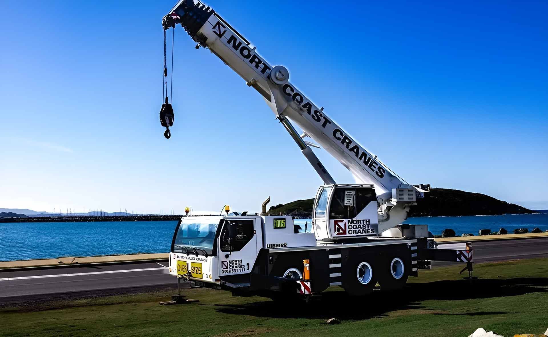 A Large Crane Is Parked in Front of A Body of Water — North Coast Cranes In Armidale, NSW
