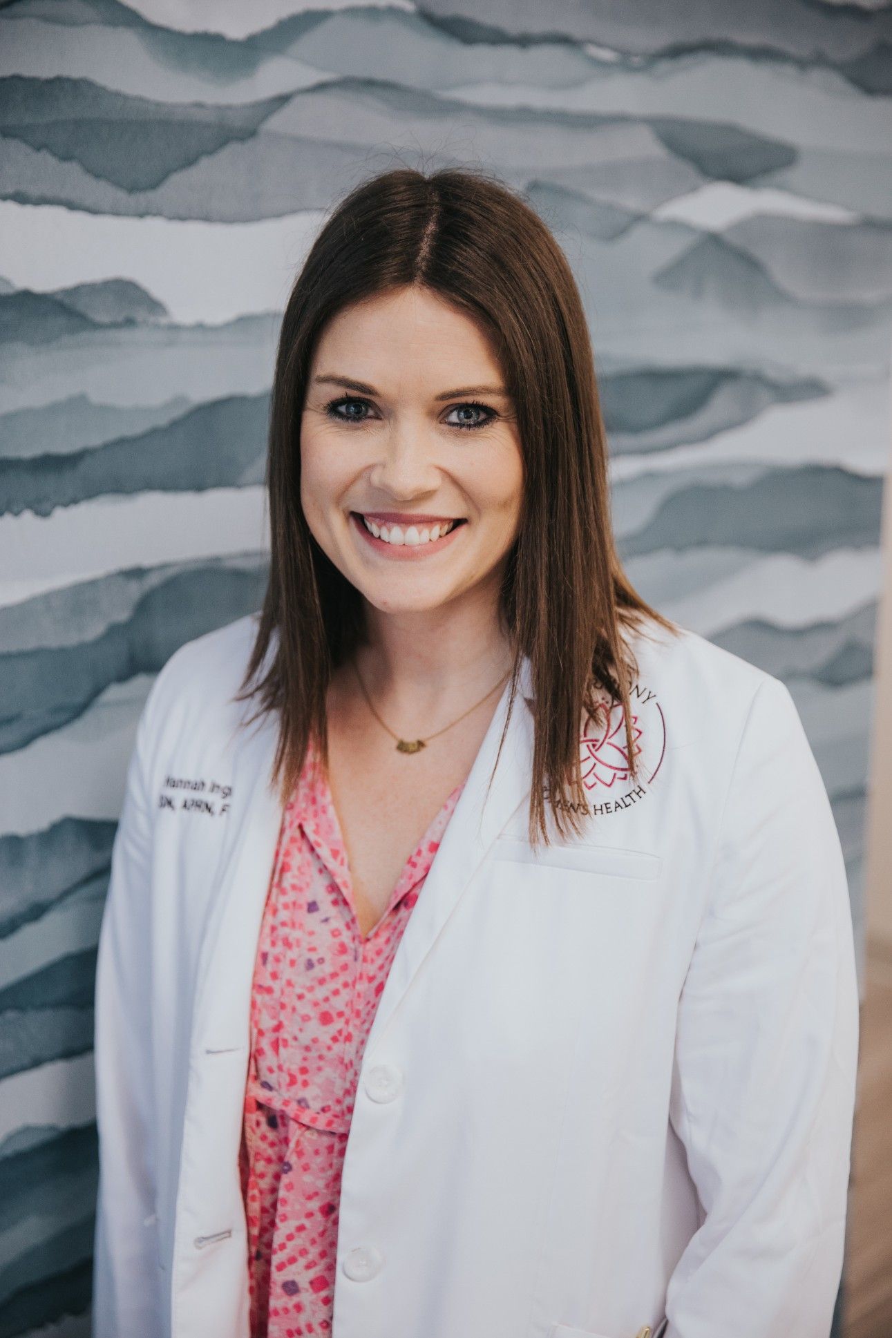 Headshot of Hannah Ingram, FNP in white doctor's coat