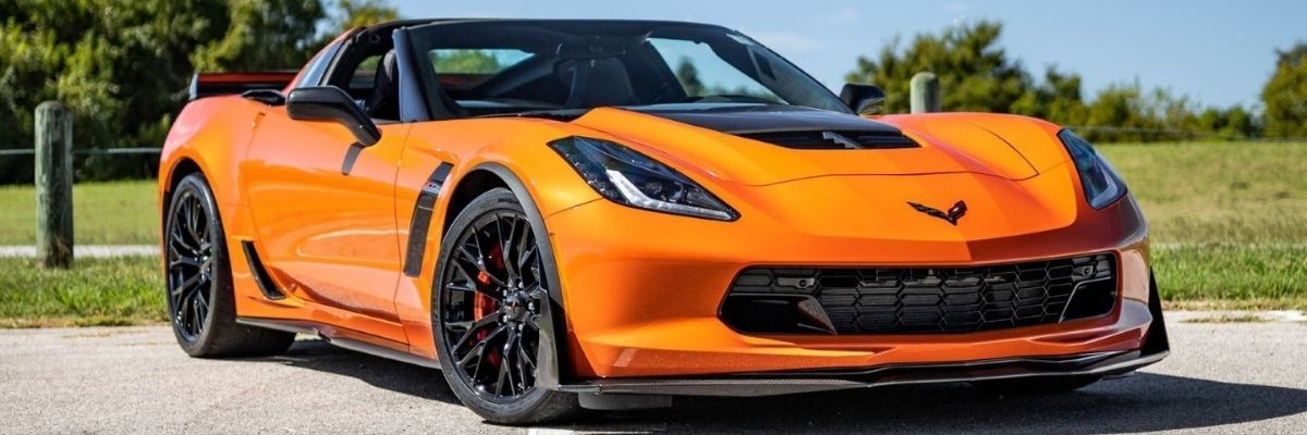 A close up of an orange corvette zr1 with FormulaOne window tint.