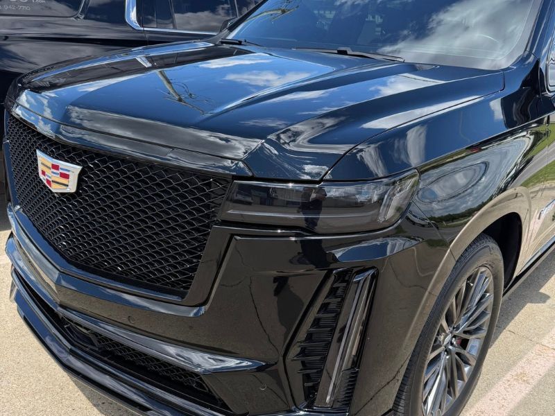 Escalade V with tinted paint protection film installed on the headlights and taillights