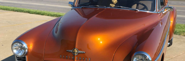Vehicle hood protected with self-healing LLumar paint protection film