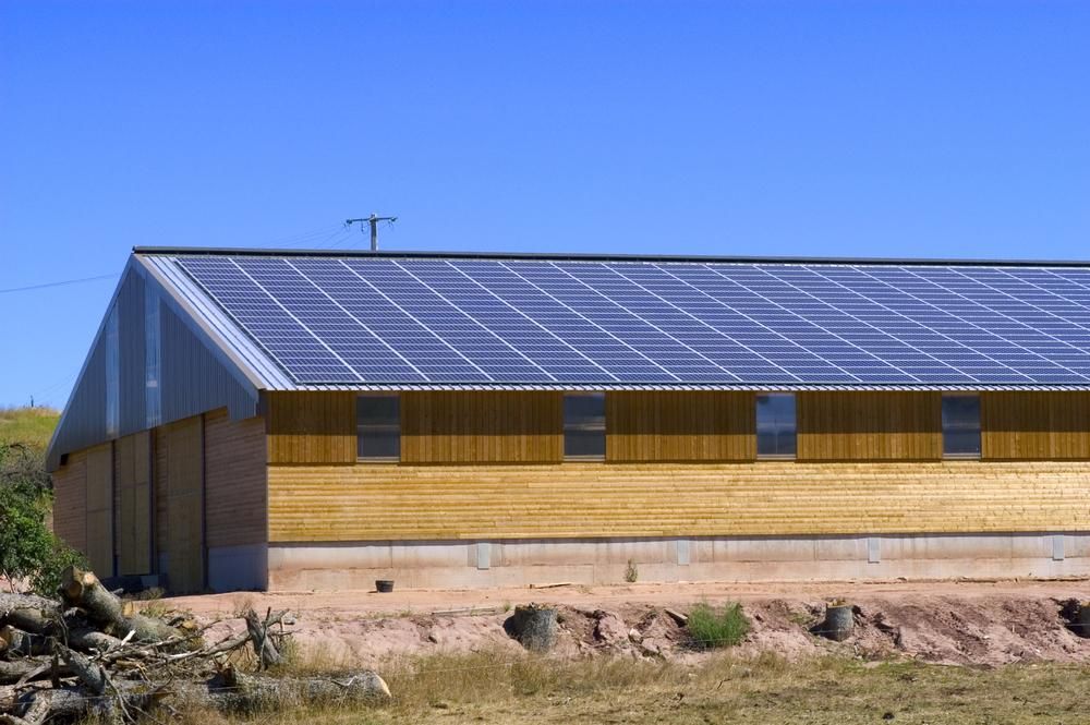 A Building With A Lot Of Solar Panels On The Roof — Mission Solar And Electrical In Tully, QLD