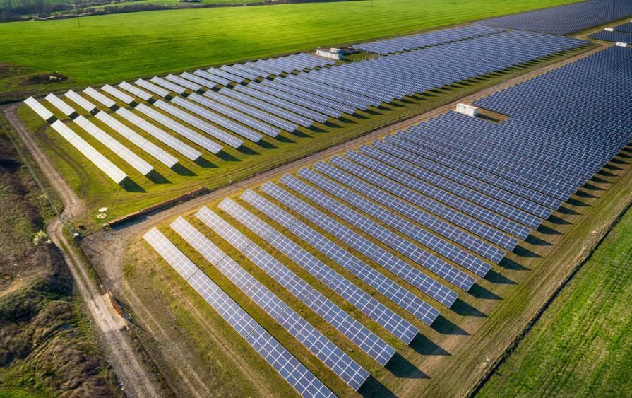 An Aerial View Of A Large Solar Farm In A Field — Mission Solar And Electrical In Mission Beach, QLD