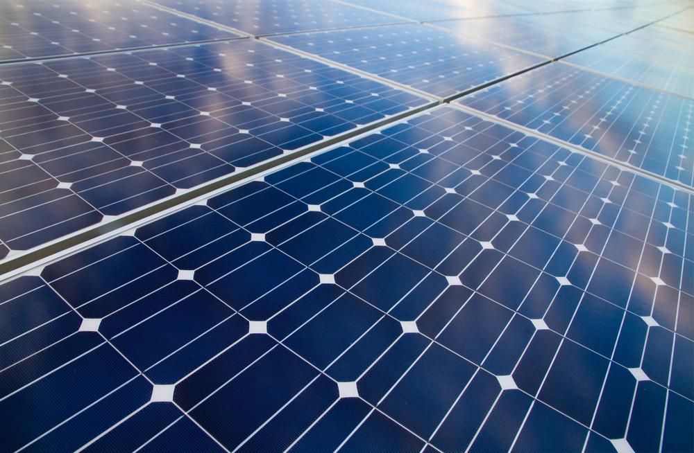 A Close Up Of A Row Of Solar Panels On A Roof — Mission Solar And Electrical In Tully, QLD