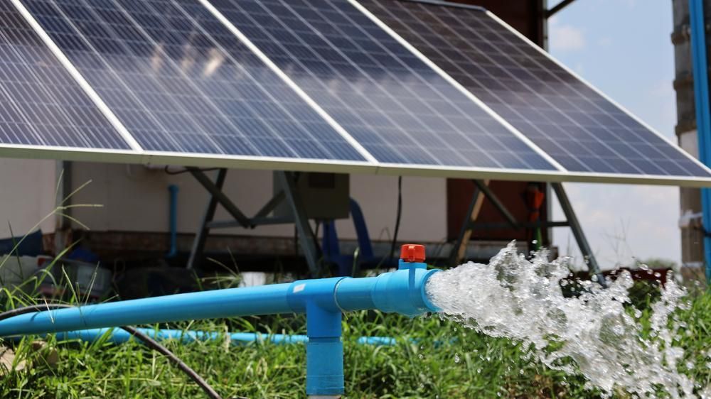 A Solar Panel Is Being Used To Pump Water From A Pipe — Mission Solar And Electrical In Innisfail, QLD