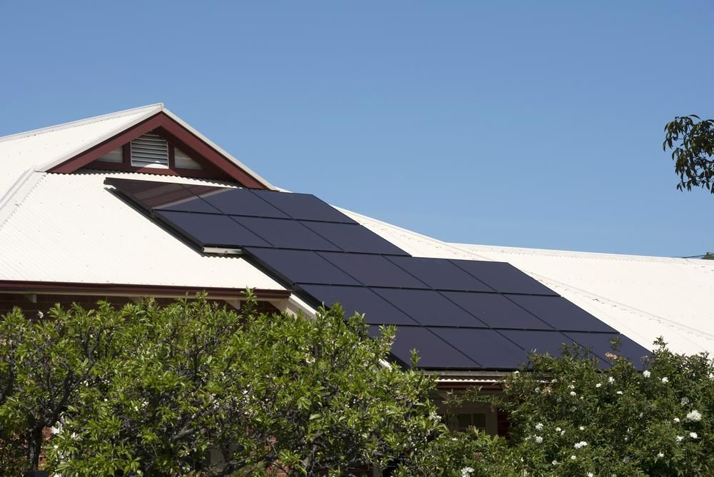 A House With A Lot Of Solar Panels On The Roof — Mission Solar And Electrical In Tully, QLD