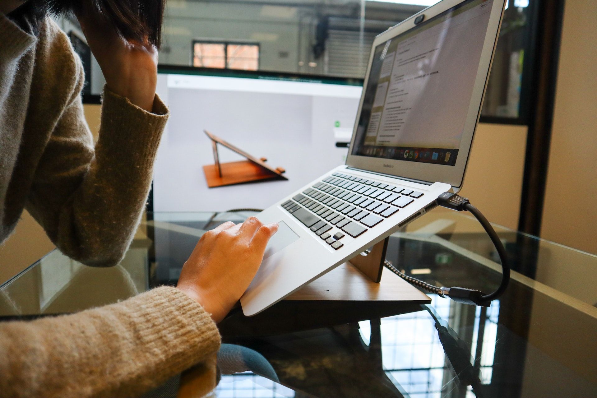Blog cover of someone using a computer for CNCTD Designs' blog Understanding the User Experience: Be