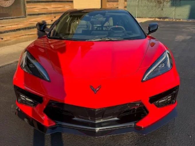 Red Chevy Corvette C8 parked outdoors with a glossy ceramic coating on the surface