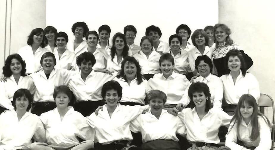 A black and white photo of the original members of the ANNA Crusis Feminist Chorus in 1975.