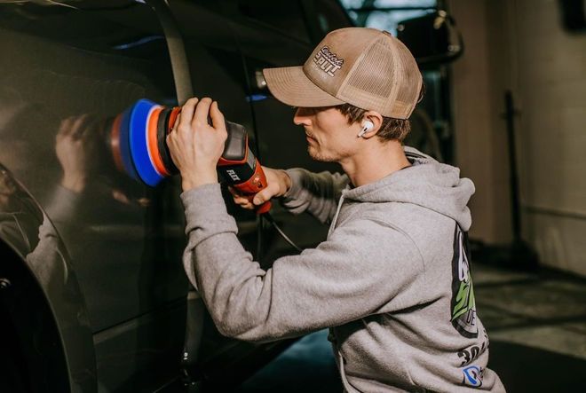 Dustin buffing a Mercedes