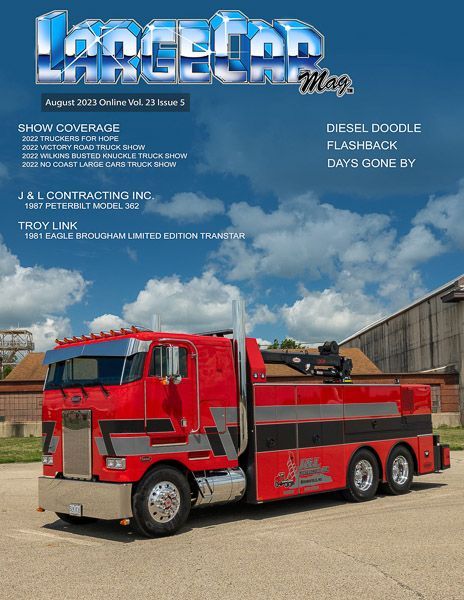 A red tow truck is on the cover of a magazine